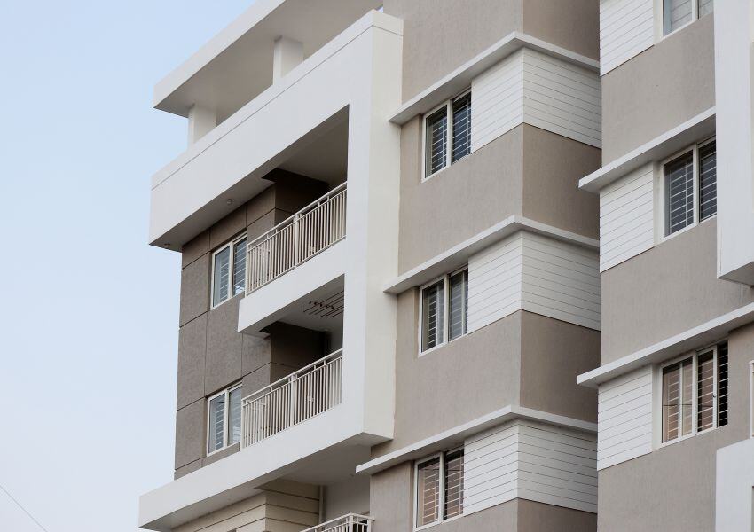 exterior of a grey and white apartment building